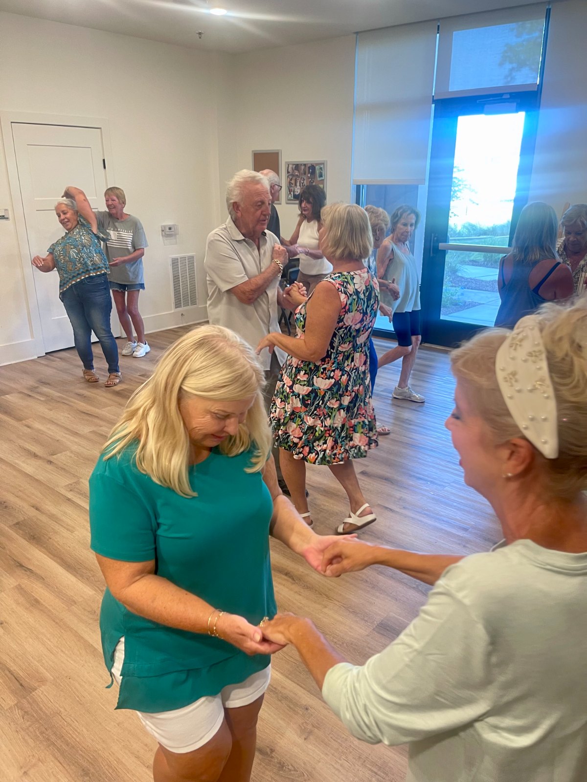 Residents dancing together during a community class