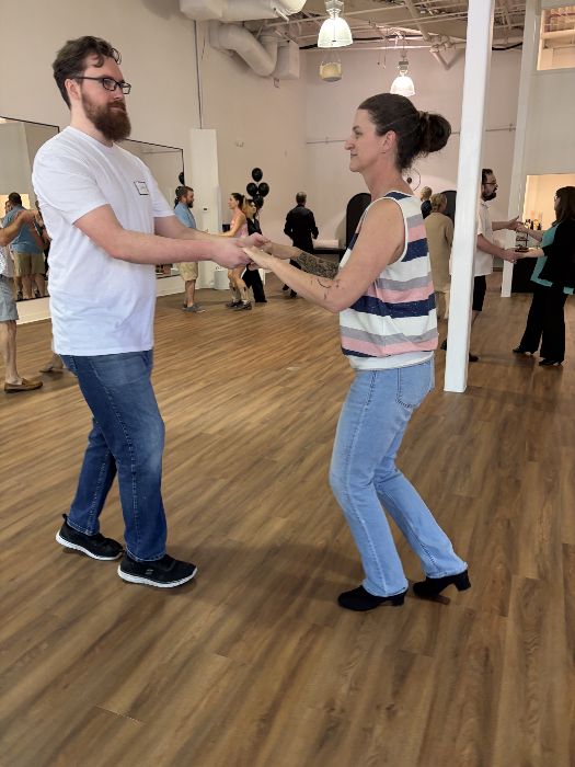 A couple practicing a turn together