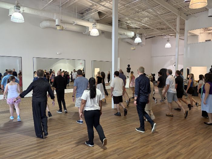 The full floor moving together in a group class