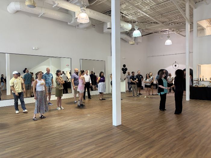 Guests gathered on the floor before a lesson